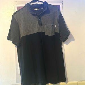 Calvin Klein 2 button ss polo shirt w/one pocket.  Size large. 100%cotton